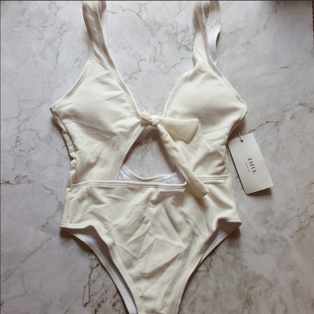 White one piece with cut outs!!